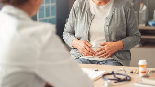 Patient during consultation for abdominal pain with gastroenterologist