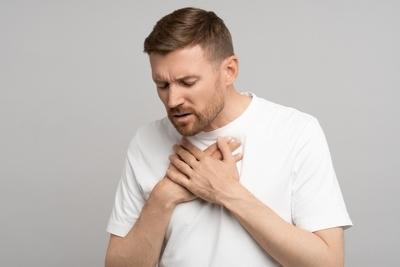 Heroimage0670402001743706145 Man-in-white-shirt-clutching-chest-in-discomfort
